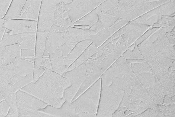 white abstract background of paste filler and bonding plaster with irregular dashes and strokes white abstract background of paste filler and bonding plaster with irregular dashes and strokes putty stock pictures, royalty-free photos & images