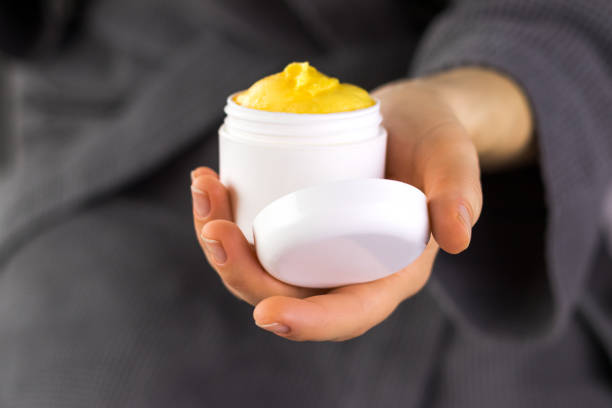 istock Woman holding opened plastic container with cream in her hands. 1226983392