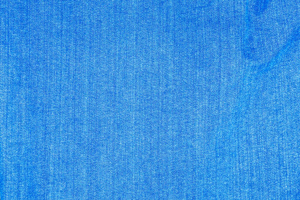 Light blue denim fabric photographed close up