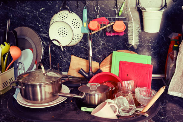 istock Cooking utensils after cooking and feast dumped not washed in the sink 1226983564