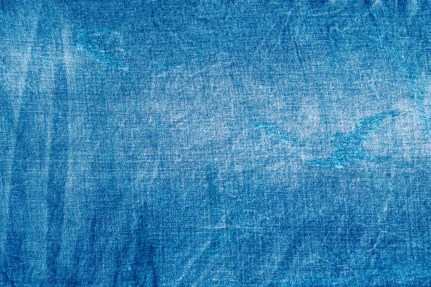 istock Light blue shabby jeans. Denim fabric. Aged in production 1226983673