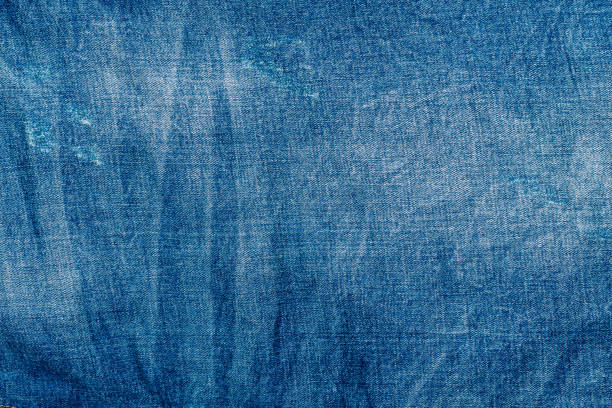 istock Light blue shabby jeans. Denim fabric. Aged in production 1226983736