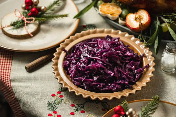 Close-up of red cabbage served on table. Christmas menu on dining table.