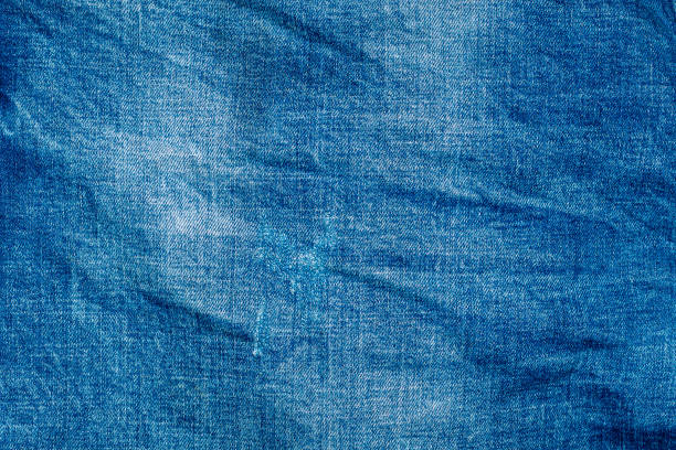 istock Light blue shabby jeans. Denim fabric. Aged in production 1226984240