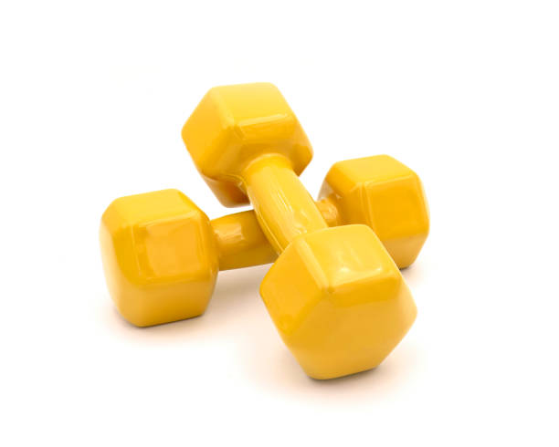 A pair of yellow dumbbell isolated on white. Clipping path
