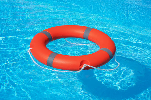 istock lifebuoy pool ring float. Life ring in swimming pool. 1226988408