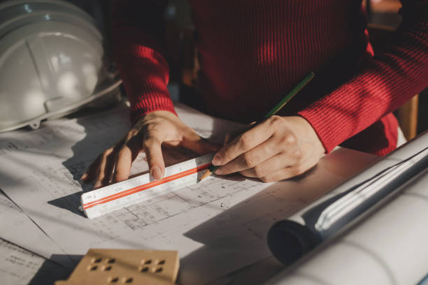 istock architect, engineer or interior designer hands drawing with pencil and mock up blueprint on workplace desk in office center at construction site, construction, engineering and architectural concept 1226988869