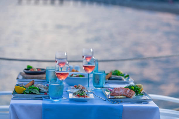istock Various seafood dinner table ready at seaside with appetizers and drinks at afternoon 1226989449