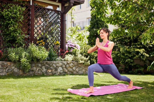 istock Woman doing yoga in her backyard. 1226989882