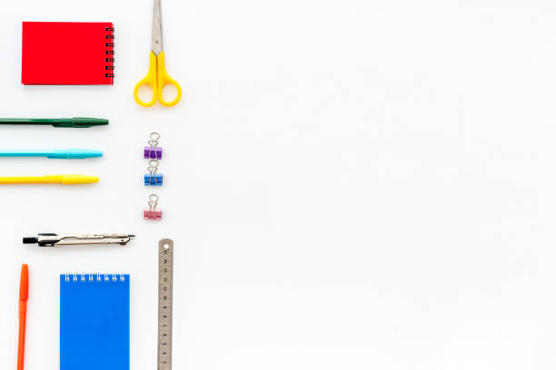 istock School supplies pattern - notebook, pen, ruler, sciccors - on white table top-down copy space 1226991162