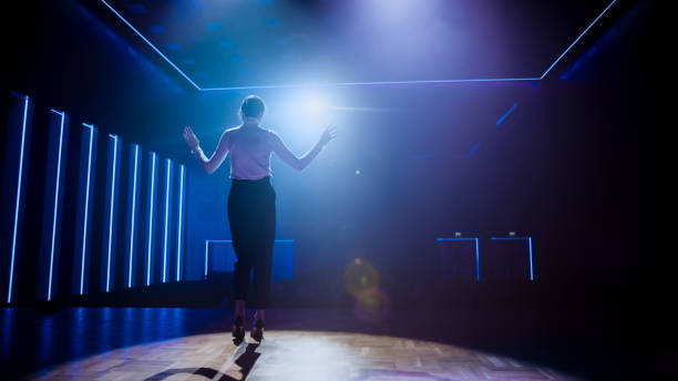 istock Famous Female Entertainer Gets on the Stage, Greets Audience, Starts Performance. Software Company Founder, Tech Marketing Guru Making a Pitch, Presentation Speaker Giving Talk. 1226991386