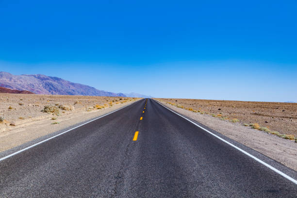 istock empty road through  the death valley desert 1226991634