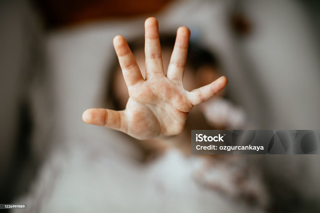 Girl making stop gesture A girl showing 5 with her fingers Child Abuse Stock Photo