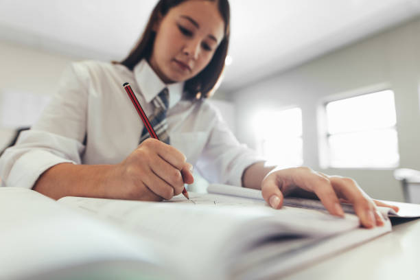 istock Female student studying in her classroom 1226992922