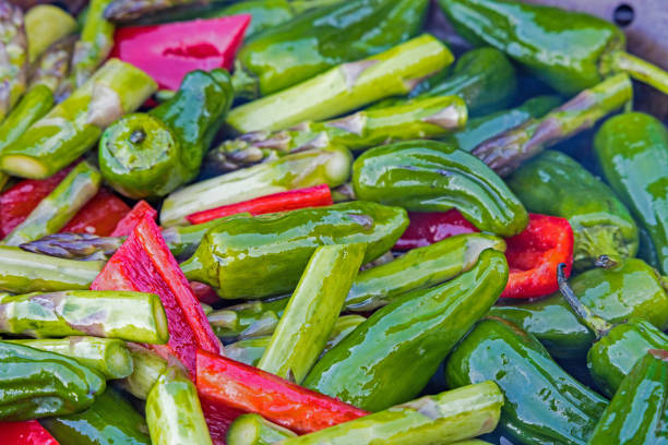 some vegetables like asparagus and green pepper on the grill