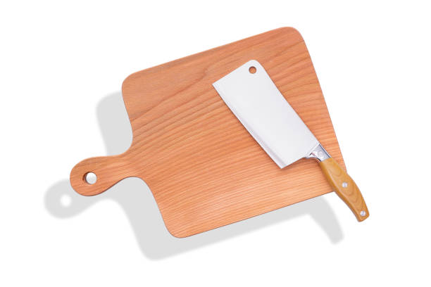 istock Natural wooden cutting board with a knife, kitchen tools. Tools for cutting products on a white background. 1226994494