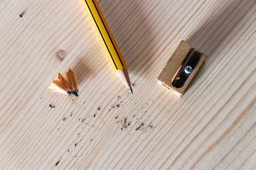 Graphite pencil, pencil sharpener and pencil shavings