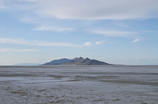 A plain view of the lone island on the salty waters of the great salt lake landscape in the evening.