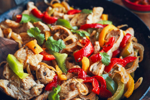 istock Fajitas de Pollo Chicken marinated Tortillas with Onions and Peppers 1227003715