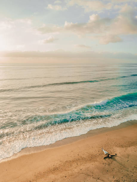 istock Woman lying down on the beach 1227003747