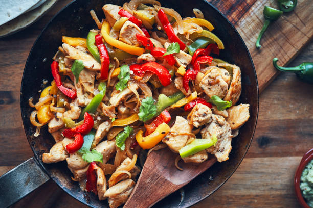 istock Fajitas de Pollo Chicken marinated Tortillas with Onions and Peppers 1227003986