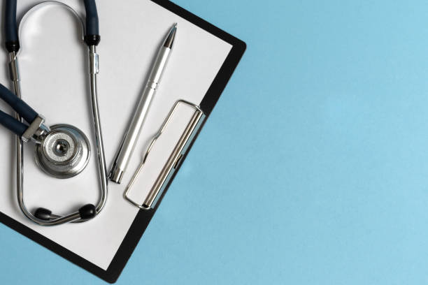 istock Paper tablet and stethoscope on a blue background. 1227004301