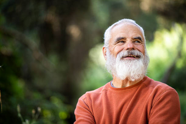 портрет активного старшего человека - beard senior men looking away smiling стоковые фото и изображения