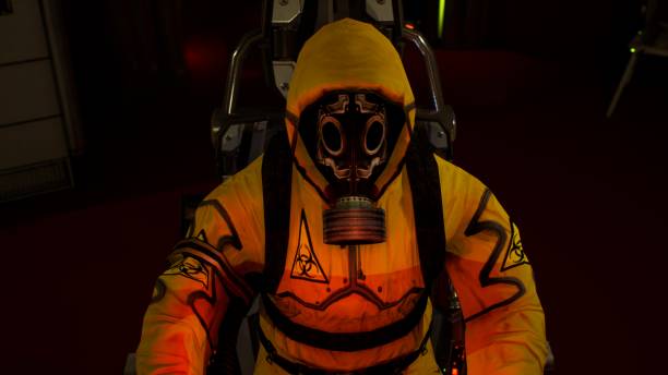 istock A medic in protective chemical clothing is working at a computer. A man in a yellow bacteriological protective suit and gas mask. 3D Rendering. 1227006997