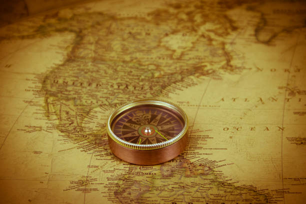 istock Compass on a vintage world map. Retro style 1227008404