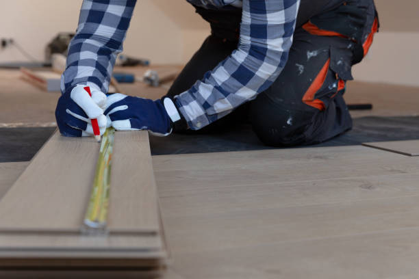 istock Construction worker installing laminate floor in a new renovated attic. Home improvement concept. 1227008674