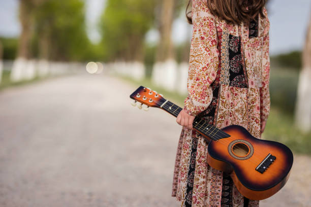 istock Girl holding ukulele 1227009170