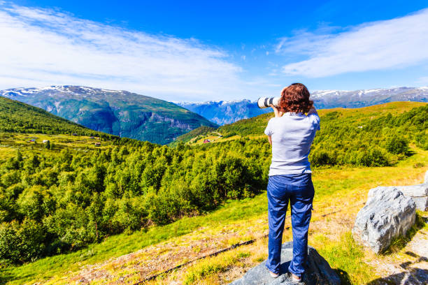 istock Tourist taking photo in norwegian nature 1227009197