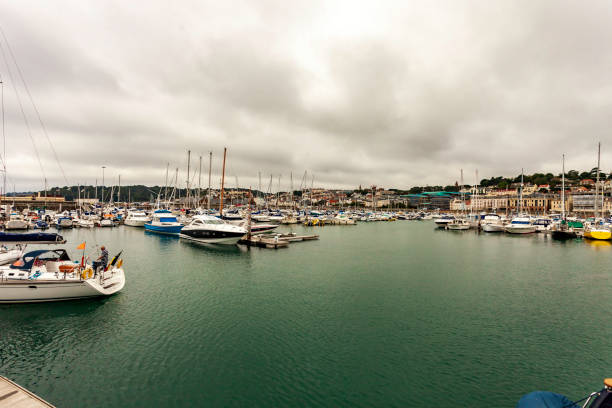 Marina and surrounding town at Saint Peter Port on the Isle of Guernsey Marina and surrounding town at Saint Peter Port on the Isle of Guernsey guernsey city stock pictures, royalty-free photos & images
