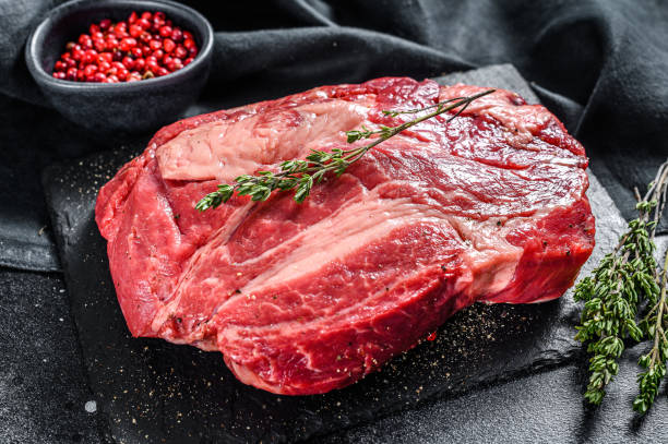 istock Raw Chuck eye roll steak. Organic beef. Black background. Top view 1227014010