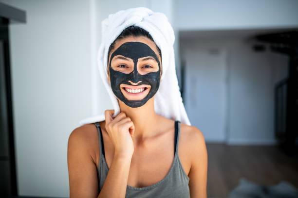 istock Smiling woman having a spa day at home. 1227014873