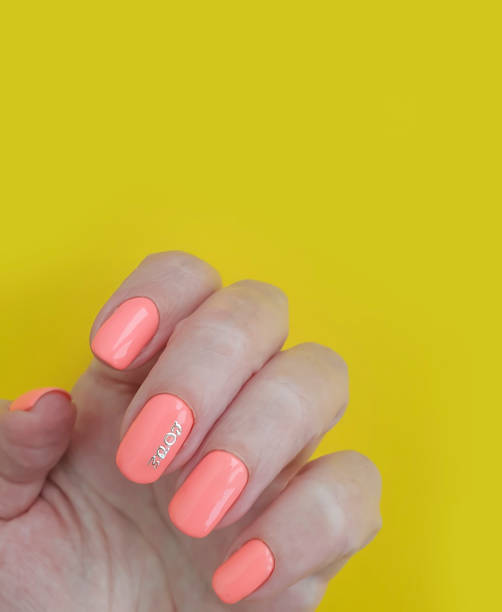 istock female hand beautiful manicure on a colored background 1227016337