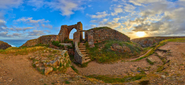 Grosnez Castle Panoramic Image Panoramic image of Grosnez Castle keep constructed circa 1330 and located in the North West corner of Jersey early morning with the sea in the background and blue skys.  Jersey, Channel Islands, UK channel islands england stock pictures, royalty-free photos & images