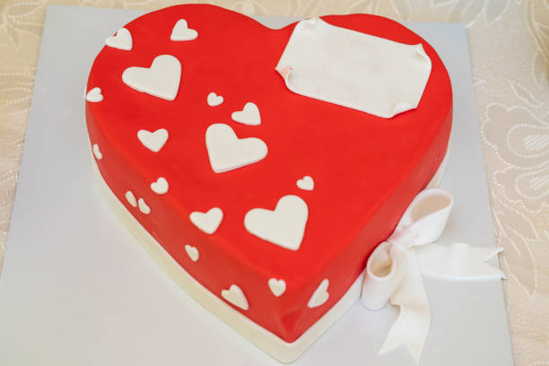 istock Red heart shaped cake for birthday or Valentine's Day with blank space for text. Close up. 1227020227