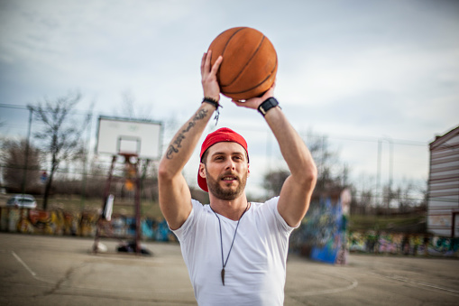 A guy with a basketball on the basketball court
