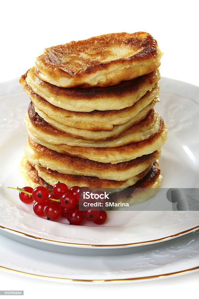 Pancakes with red currants. Pancakes with red currants isolated on a white background. Berry Fruit Stock Photo