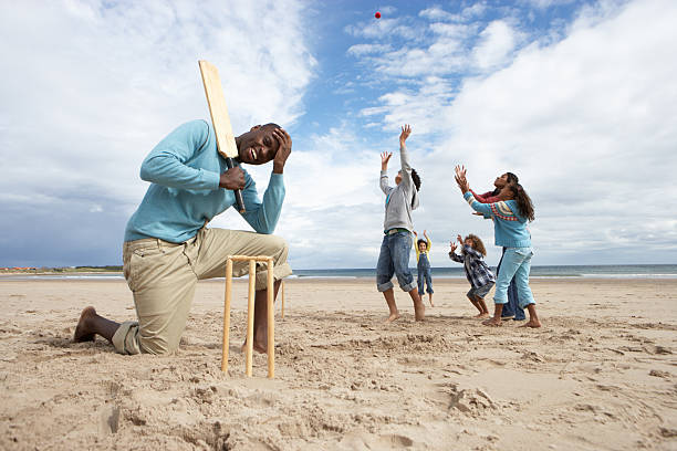 istock Family playing cricket on beach 122702744