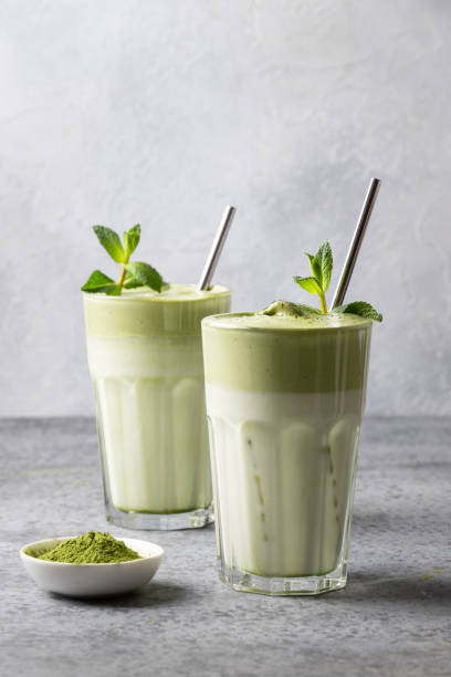 istock Two glasses of Dalgona Matcha latte tea. Close up. Vertical format. 1227028128