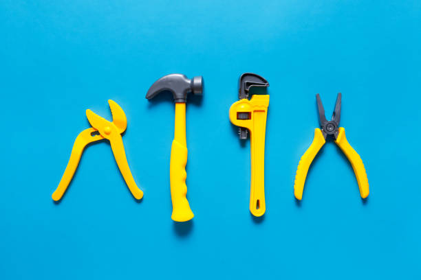 istock Toys background. Top view of toy tools on blue background 1227029155