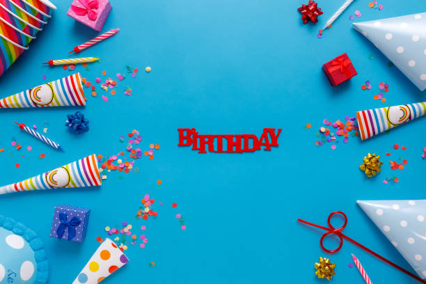 flatlay Birthday party card on a blue background. with copy space for text.