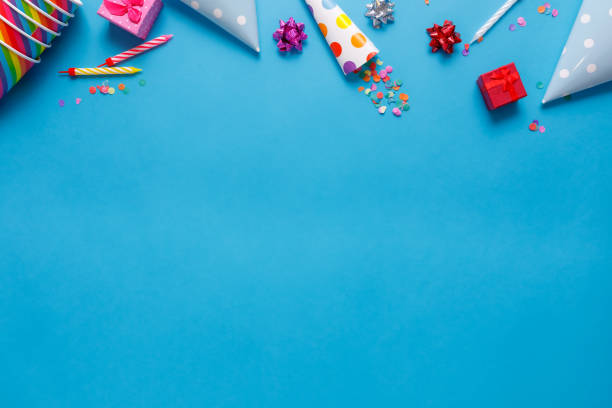 istock flatlay Birthday party card on a blue background with copy space for text 1227029431