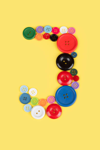 istock Letter J made of sewing buttons 1227030707
