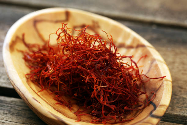 istock Kesar, Saffron, Crocus Sativus on rustic table, Pile of indian Saffron 1227032603