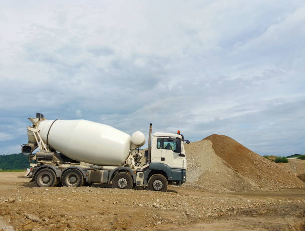 istock Concrete mixer truck working on construction site. 1227033775