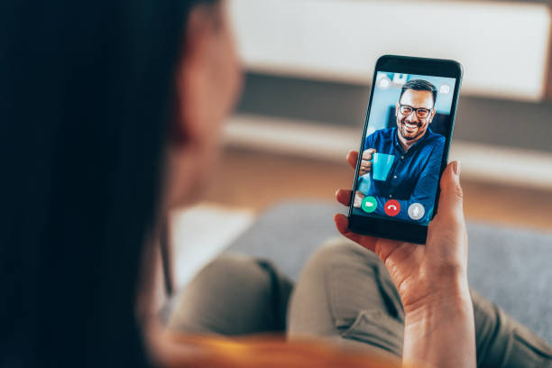 Online meeting with friend Woman using laptop for video conference to connect with friend from home man video call pov stock pictures, royalty-free photos & images