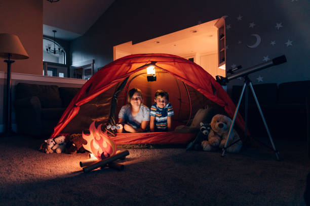 istock Boy and Girl Camping Indoors 1227035083